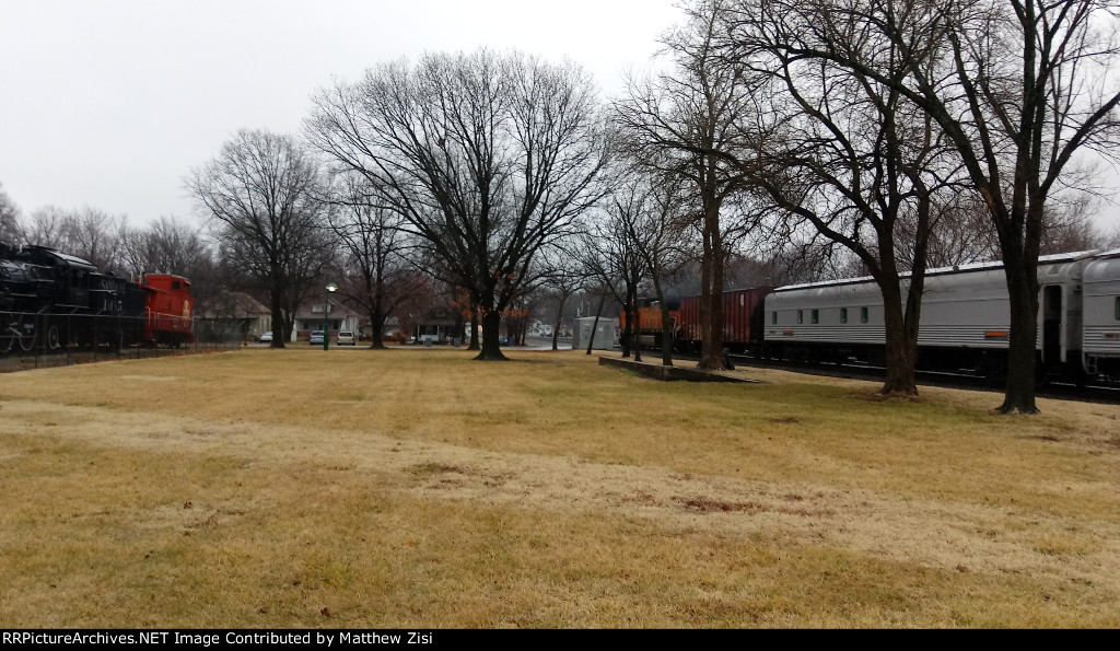 Passenger Train Passing Steam Engine